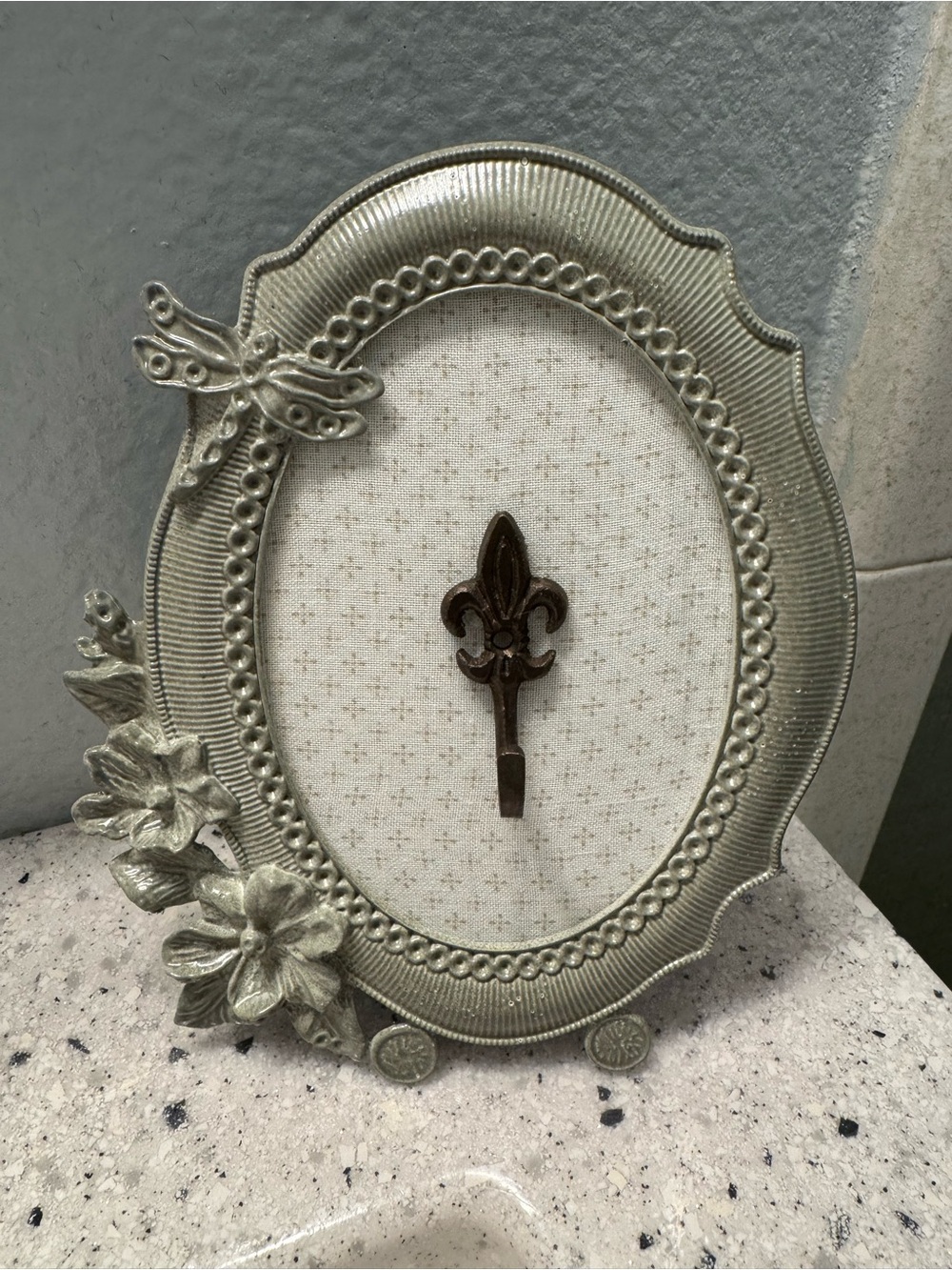 Ornate Silver-Tone Oval Decorative Frame with Fleur-de-Lis Accent hook